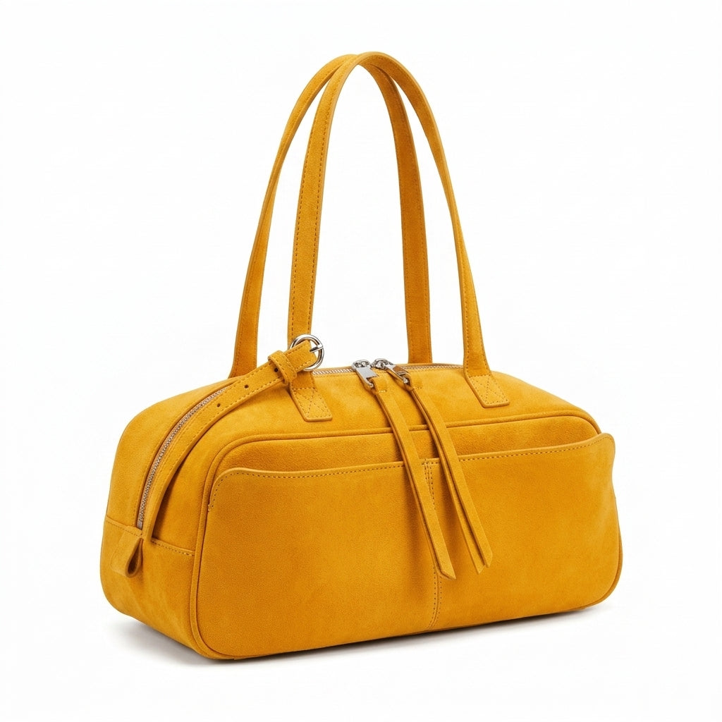The Serene Suede Barrel Bag na cor Pumpkin Yellow em fundo branco
