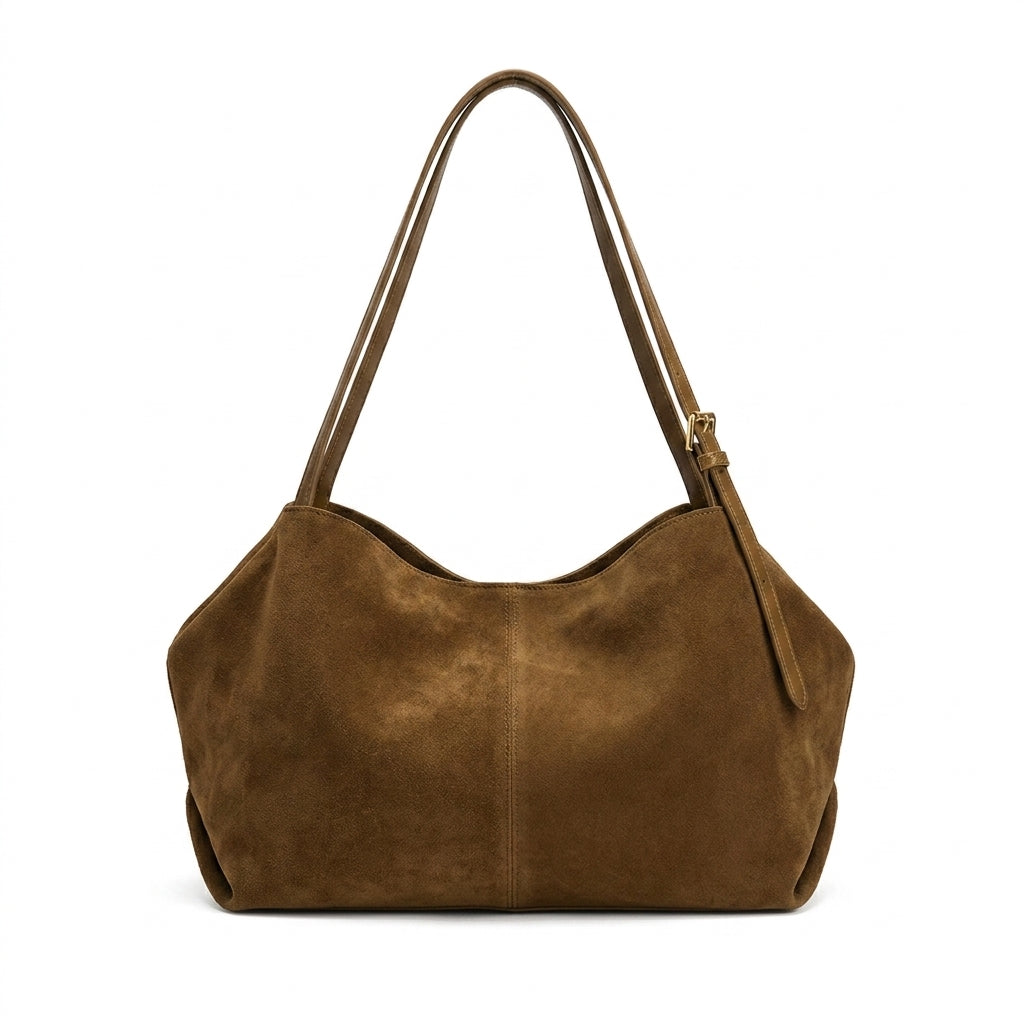 The Suede Boston Pillow Bag na cor Gold Brown suede em fundo branco