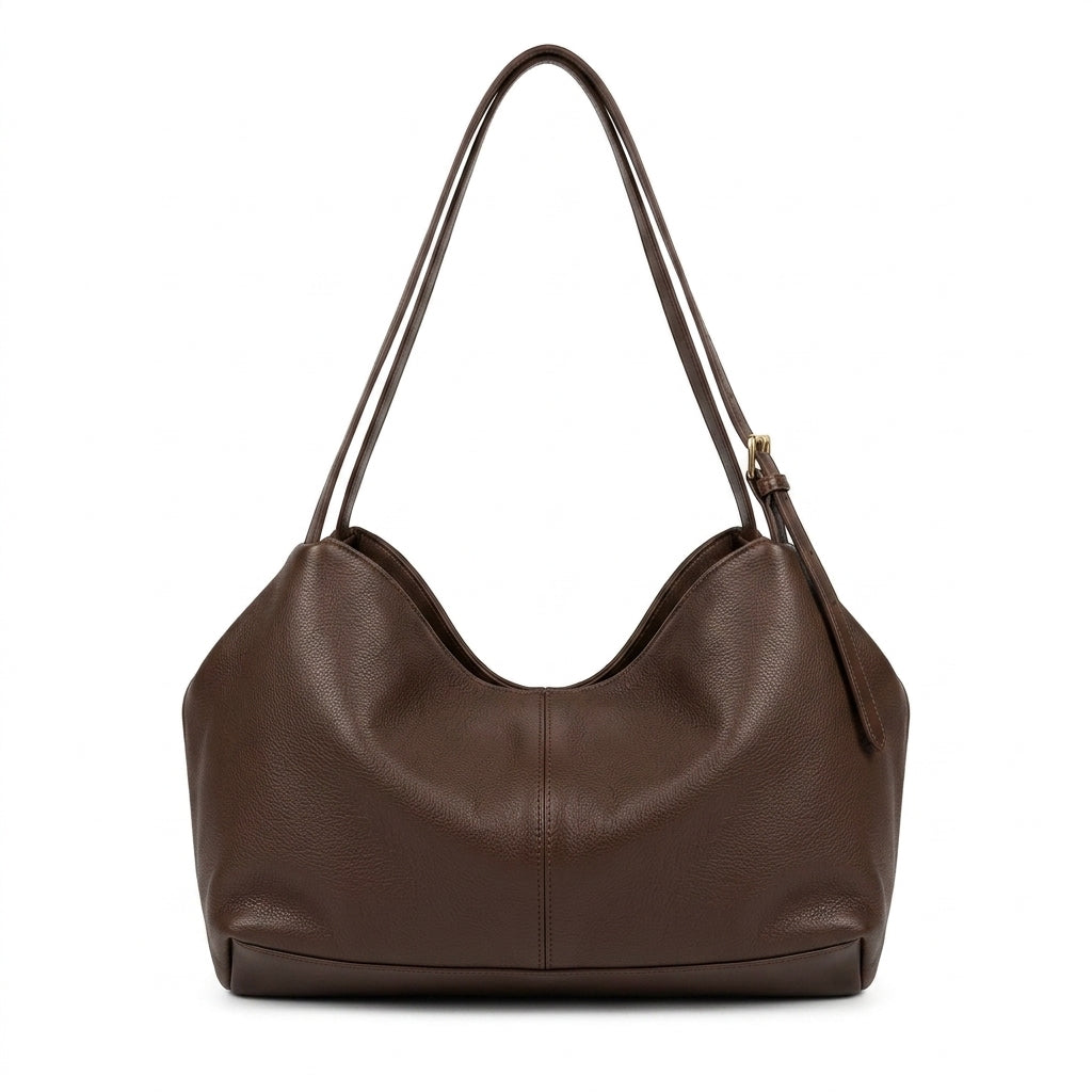 The Suede Boston Pillow Bag na cor Brownie leather em fundo branco