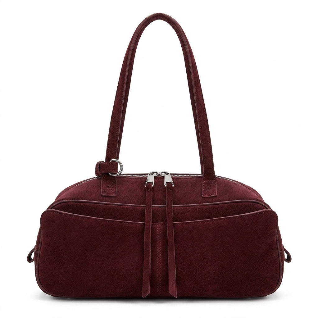 The Serene Suede Barrel Bag em fundo branco
