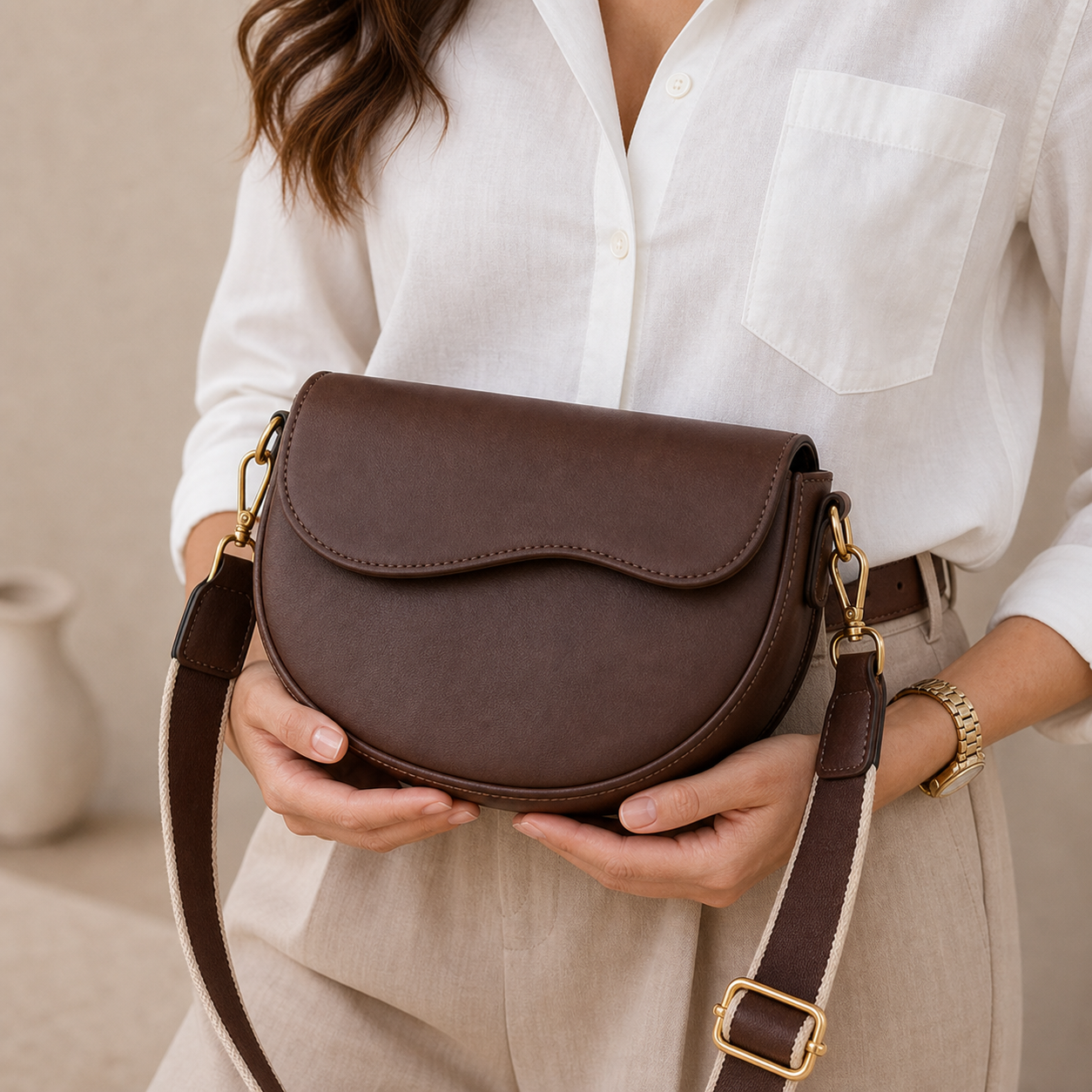 Model holding Coffee Vintage Wide Strap Saddle Bag